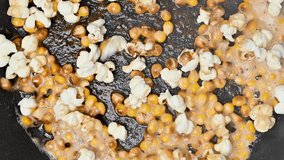 Video of popcorn being fried in a frying pan - Powered by Shutterstock - Get 15% off with code: PIKWIZARD15