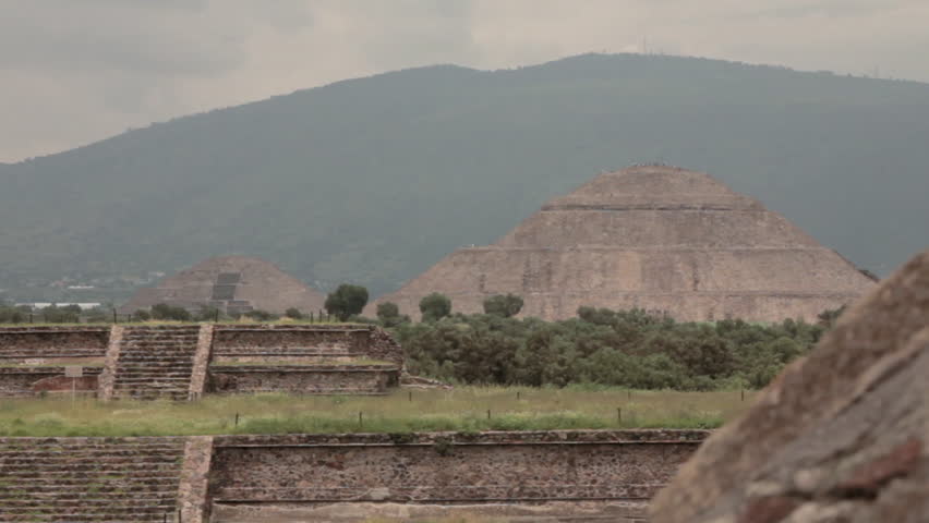 Long shot of the ancient Pyramids of Teotihuacan in Mexico, showcasing the grandeur of this historic Mesoamerican city under daylight.