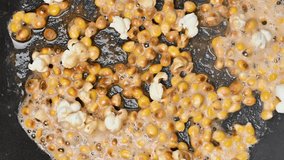 Video of popcorn being fried in a frying pan - Powered by Shutterstock - Get 15% off with code: PIKWIZARD15