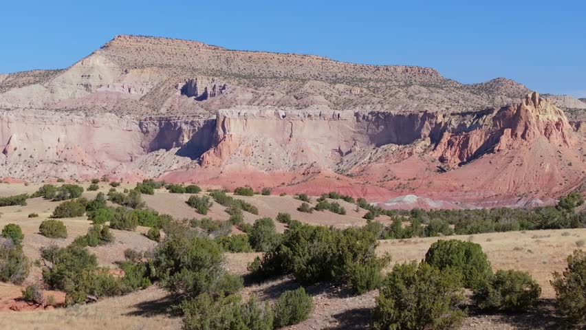 Sweeping view of New Mexico desert landscape with vivid cliffs and blue sky