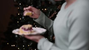 Cozy Christmas scene with cake slice and festive blue mug on table, warm bokeh lights in background - Powered by Shutterstock - Get 15% off with code: PIKWIZARD15