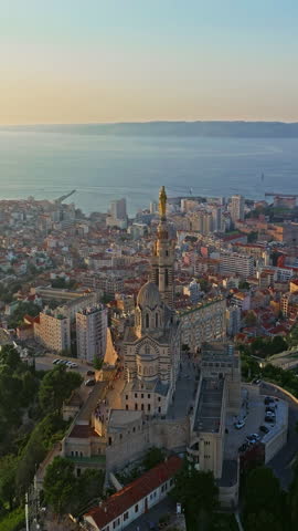  Many boats and yachts are parked in the city marina. Aerial view of the port of Marseille in the morning sun. Drone view of Marseille in the south of France