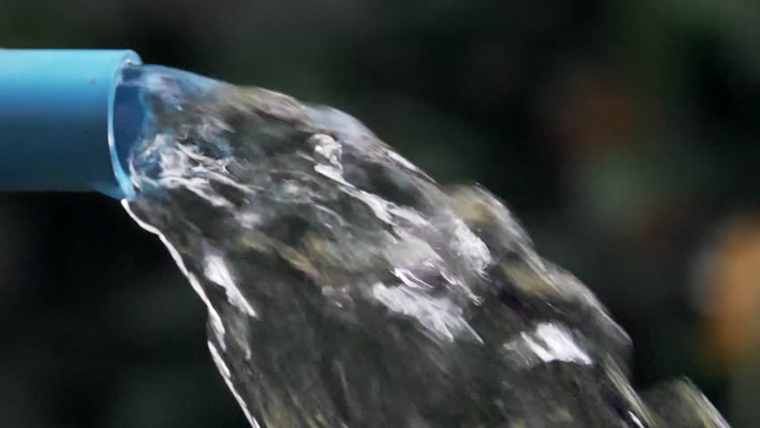 Flowing Water: Capturing the essence of purity and refreshment, this image showcases a stream of water emerging from a pipe, evoking feelings of vitality and natural wonder.