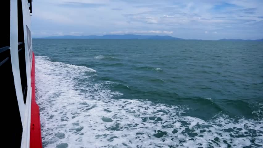 Ocean Voyage: A captivating voyage across the boundless ocean, with waves glistening under a vast, cloud-filled sky.