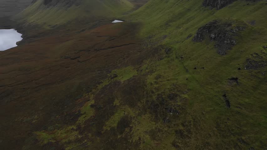 Aerial drone view of the Quiraing area in the Isle of Skye on a cloudy day - Nature and travel concepts in one of the most remote areas of Scotland with beautiful panoramas and sceneries