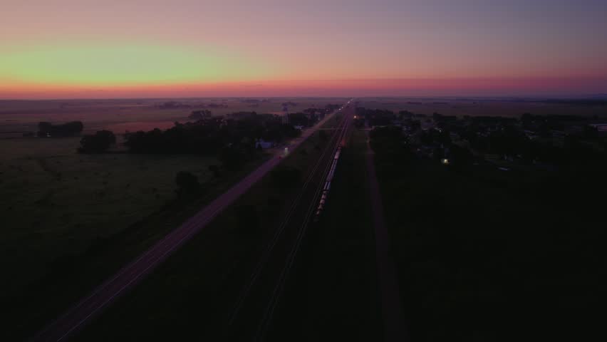 Aerial view of road and railroad tracks with a stunning sunset skyline in Omaha, Nebraska, United States