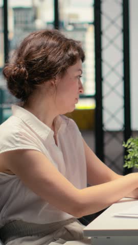 Vertical Video HR admin conducting a job interview with a black hopeful candidate with amazing experience and recommendations. Doing evaluation for alignment with corporate hiring standards. Camera B.