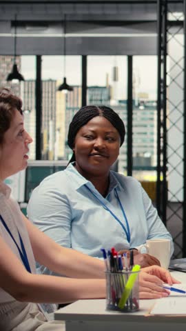 Vertical Video HR experts team evaluating a candidate profile and CV during meeting, reviewing qualifications and professional experience before the selection of perfect applicant. Talent acquisition