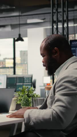 Vertical Video Diverse recruiters evaluating an applicant CV resume during interview session focused on selecting candidates with relevant qualifications and strong career ambition. Head hunting