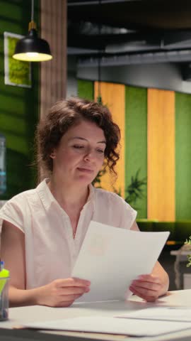 Vertical Video HR professional interviewing a female candidate in a career advisory session during the selection process, CV resume used to discuss employment opportunity. Talent acquisition. Camera A