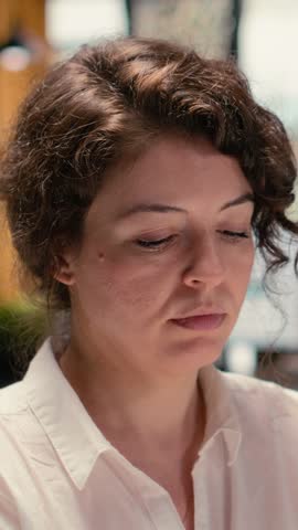 Vertical Video African american candidate presenting resume information with HR worker during job interview meeting in office. Career development and potential employment with his qualifications