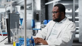 Chemical engineer in lab inspecting chemical compounds in vials for purity verification using PC software. Man in laboratory preparing reagent test tubes for assay procedures on computer, camera B - Powered by Shutterstock - Get 15% off with code: PIKWIZARD15
