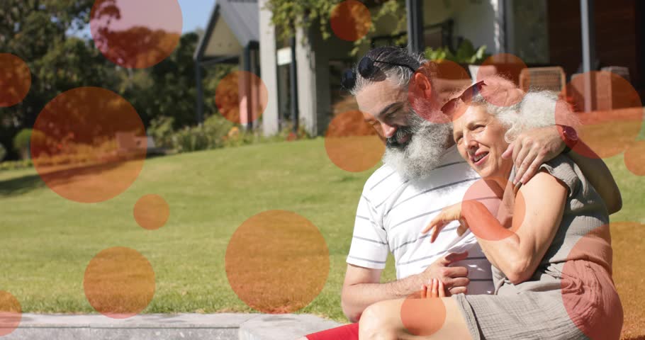Mature couple sitting on low curb, man leaning, orange overlays shifting, camera zooming, marketing. Senior, partners, outdoor, porch, frontyard, lawn, garden