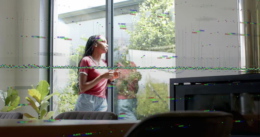 Woman standing near sliding glass door glancing glass and lifting cup, tech glitch overlay growing. Reflection, distortion, interior, daylight, backyard, plants, headband