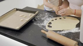 Mother and child baking cookies together in the kitchen - Powered by Shutterstock - Get 15% off with code: PIKWIZARD15
