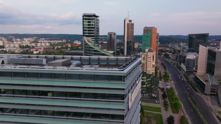 Modern office buildings shape the skyline in an aerial view of Vilnius, Lithuania. Rooftop HVAC systems emphasize the significance of climate control in urban settings