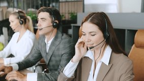 Consultants assisting clients in a busy call center, providing technical support and customer service - Powered by Shutterstock - Get 15% off with code: PIKWIZARD15