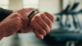 Smart watch using in gym, Close up of woman hands im gym checking incoming notification on smart watch. Incoming text message received on app smartwatch. Social media networking technology concept. - Powered by Shutterstock - Get 15% off with code: PIKWIZARD15