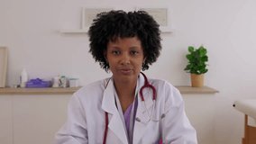 POV screen view of young African American female doctor listening patient, communicating in video call from her medical office. Telemedicine, healthcare and digital consultation concept. - Powered by Shutterstock - Get 15% off with code: PIKWIZARD15
