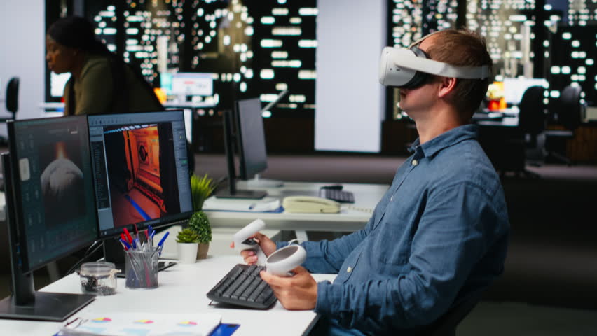Professional male developer operating VR glasses to create spaceship station as game lobby, gaming development for the industry. AI generating modern spatial project on dual monitors. Camera B.