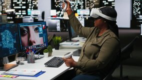 Black female graphic designer uses VR glasses and AI to edit photos, retouching content and generating professional pictures. Editor turning text to image with virtual reality. Camera B. - Powered by Shutterstock - Get 15% off with code: PIKWIZARD15