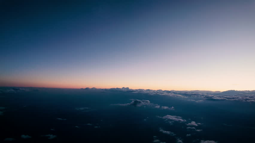 Fly in the Sky over Clouds Ocean at Sunrise