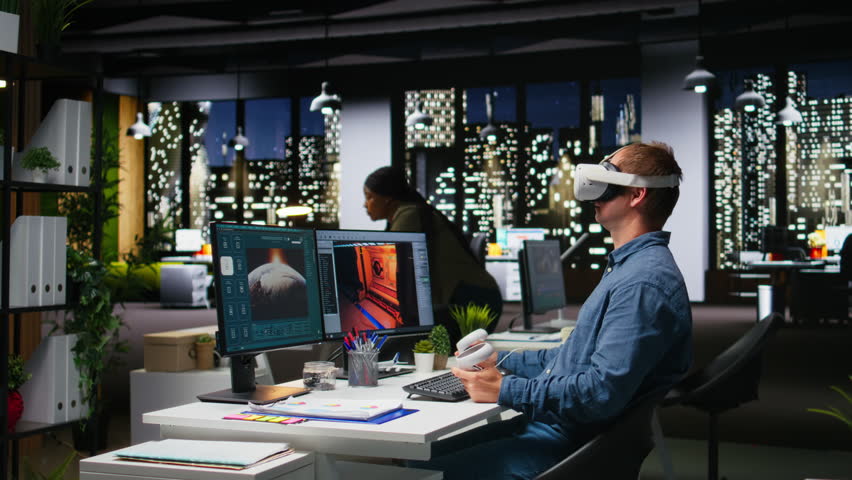 Professional male developer operating VR glasses to create spaceship station as game lobby, gaming development for the industry. AI generating modern spatial project on dual monitors. Camera A.