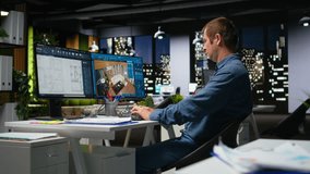 Professional worker in creative office uses CAD software and blueprints plan, designing house interior with user interface for virtual home customization. Detailed architectural layout. Camera A. - Powered by Shutterstock - Get 15% off with code: PIKWIZARD15