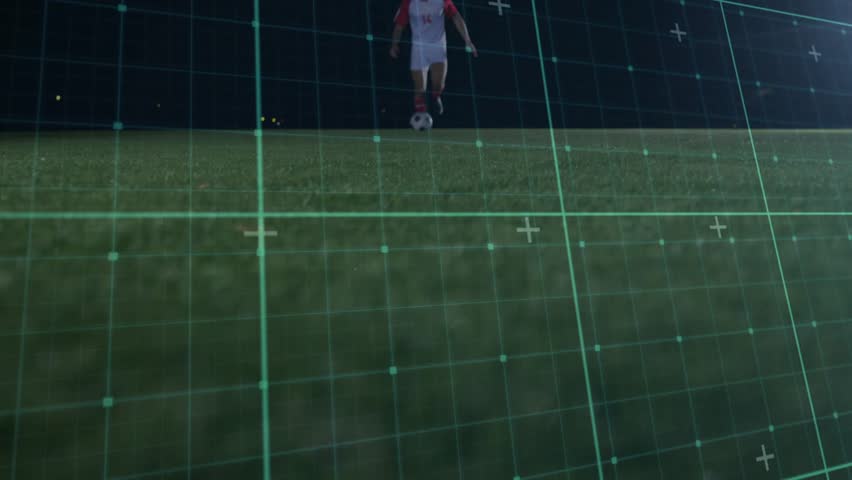 White-and-red player dribbling at night, blue player sliding to win possession, grid tracking play. Soccer, ball, outdoor, nighttime, floodlights, augmentedreality, rivalry - Powered by Shutterstock - Get 15% off with code: PIKWIZARD15