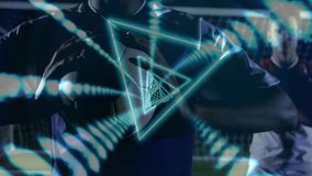 Camera framing front player adjusting grip on soccer ball, neon triangles aligning torso for sports. Teammates, athletes, advertising, digital, motion, stadium, night - Powered by Shutterstock - Get 15% off with code: PIKWIZARD15