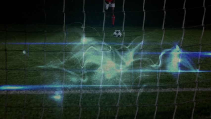 Male soccer player shifting, kicking ball behind net to score in sports while energy trailing ball. Athlete, red, jersey, cleats, outdoor, night, pitch - Powered by Shutterstock - Get 15% off with code: PIKWIZARD15