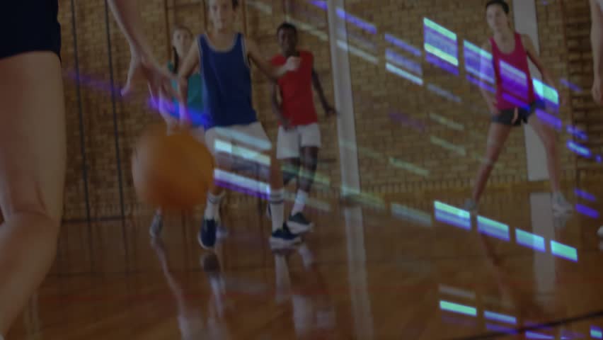 On dribbling teal shooter shooting to score in school gym, guards blocking, blue streaks glitching. Basketball, backboard, rim, court, youth, female, team