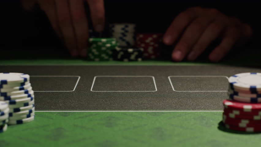 Game of poker in casino, taking place with poker chips and cards on a green table, gambling place, roulette jack pot. 
