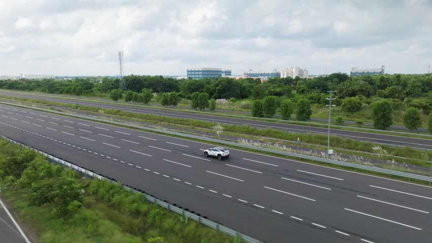 Car moving at high speed on empty road.