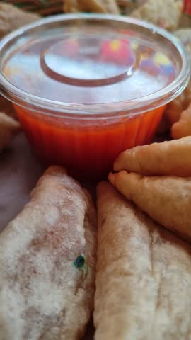 Crispy cireng served warm with spicy savory sauce, showcasing its chewy texture and irresistible street-food appeal.