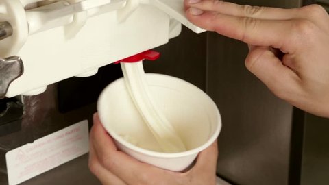 	pour ice cream to a cup