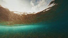 Underwater view of the ocean wave rolling and breaking on the shore during sunset in the Maldives - Powered by Shutterstock - Get 15% off with code: PIKWIZARD15