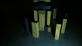 Low Key Shot of Wooden Jenga Blocks Falling Next to Colorful Reflective Sphere - Powered by Shutterstock - Get 15% off with code: PIKWIZARD15