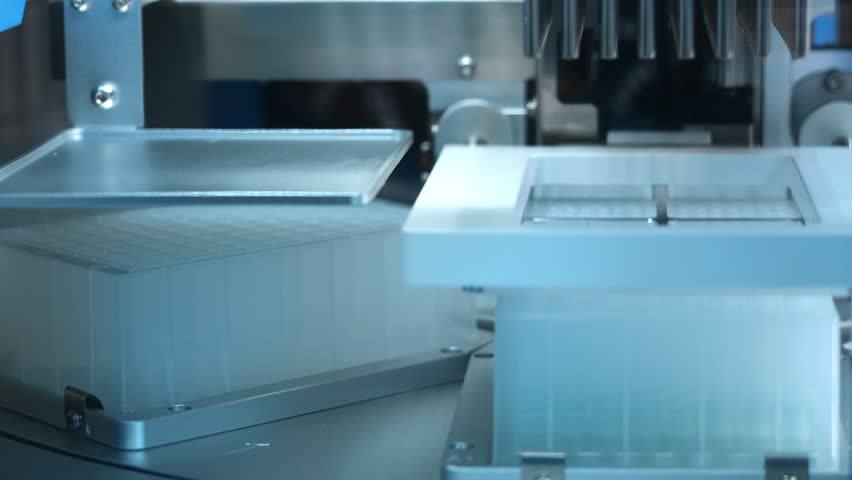 Close up of automatic PCR nucleic acid extraction station processing samples with precision tools for molecular diagnostics and genetic analysis in modern laboratory environment.