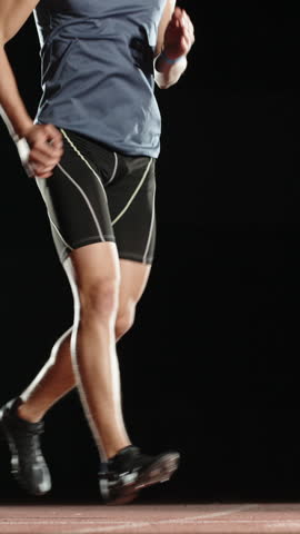 athlete man running in place vertical slow motion fullHD power motivation determination strength focus fitness perseverance endurance goal success healthy lifestyle mindset