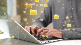 Close-up of hands typing on a laptop with floating digital file icons, representing cloud storage, data management, and online information security. technology cloud computing. - Powered by Shutterstock - Get 15% off with code: PIKWIZARD15