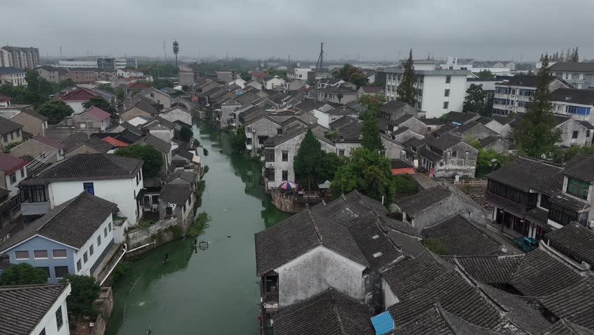 On September 20, 2025, an aerial view of Shaxi Ancient Town in Taicang, Suzhou, China, captures classic Jiangnan water-town architecture, winding waterways, and traditional riverside houses.