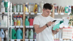  Young man buyer scanning qr code for cleaning spray in household chemicals store - Powered by Shutterstock - Get 15% off with code: PIKWIZARD15