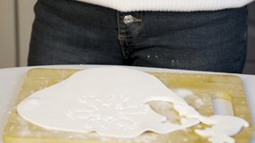 Woman is using a festive cookie cutter to make Christmas cookies - Powered by Shutterstock - Get 15% off with code: PIKWIZARD15