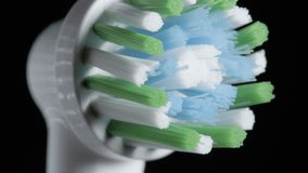 Detailed close-up view on bristles of electric toothbrush head as it oscillates - Powered by Shutterstock - Get 15% off with code: PIKWIZARD15