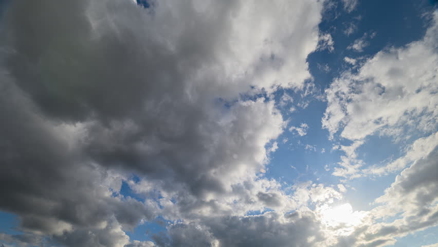 A Dramatic Cloudscape Featuring Clear Blue Sky and Bright Sunlight for Artistic Inspiration
