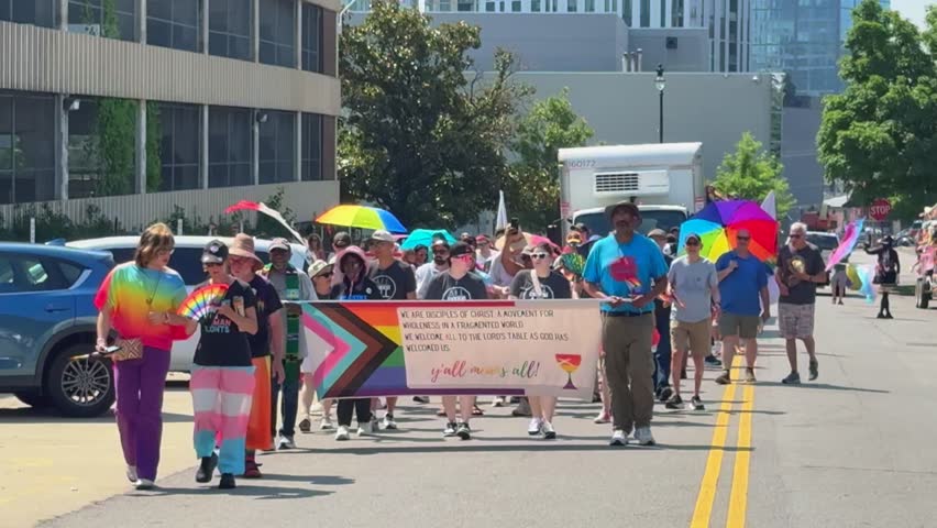 Nashville , United States - 06 28 2025: Slow Motion Street View Of People Marching At Pride Parade.