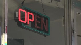 Flashing neon open sign glowing in a storefront window at night in 4K, symbolizing business, commerce, and welcoming retail atmosphere. - Powered by Shutterstock - Get 15% off with code: PIKWIZARD15