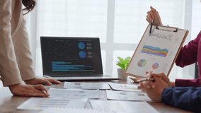 Business team colleagues collaborating on a new project, analyzing financial statistics in the office - Powered by Shutterstock - Get 15% off with code: PIKWIZARD15