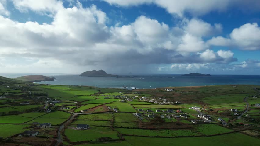 drone rising epic Irish Landscapes Dounquin and The Blasket Islands in Autumn shower over the Islands Kerry Epic Locations